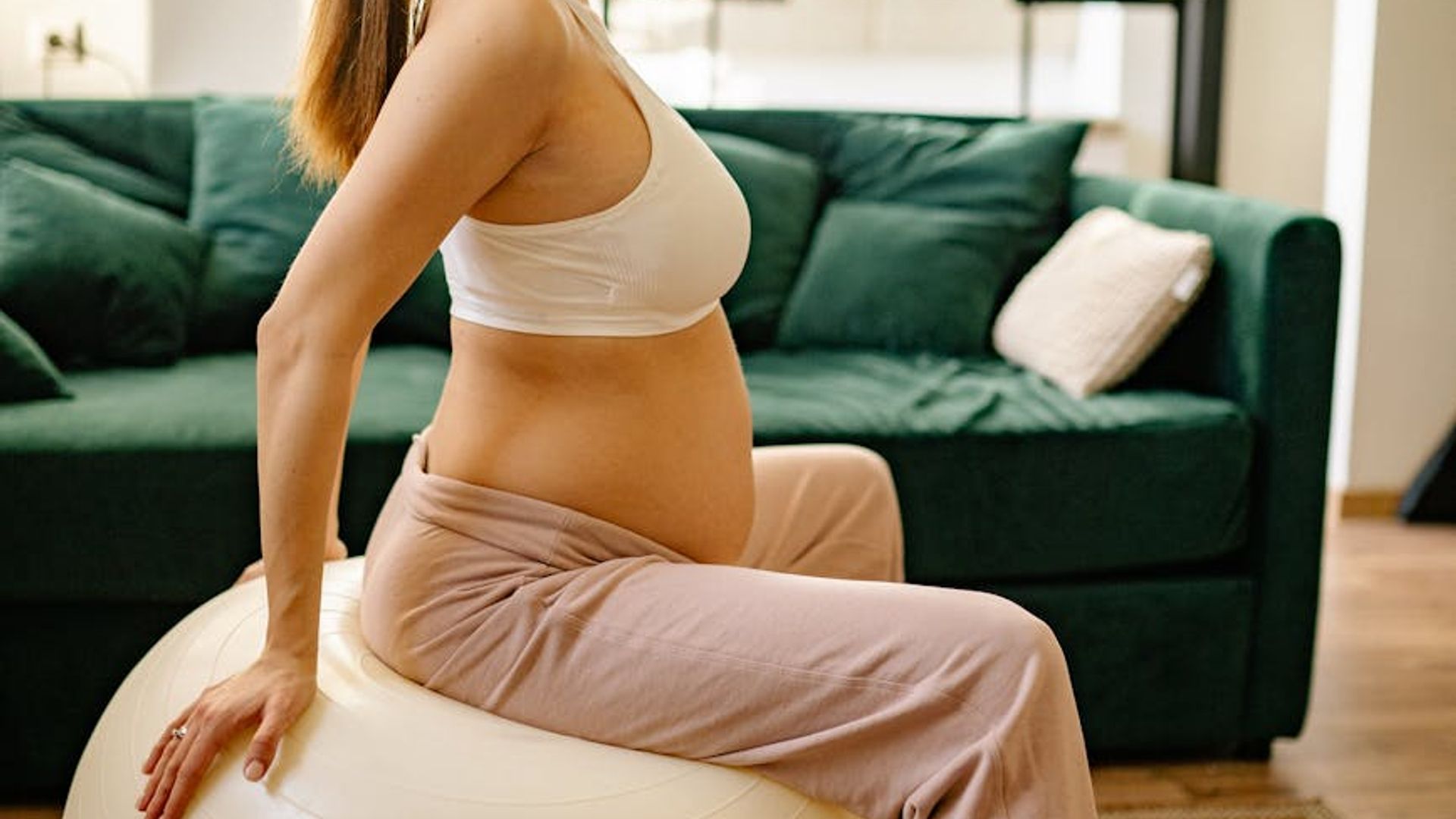 Calm and focused woman in a light-filled room.