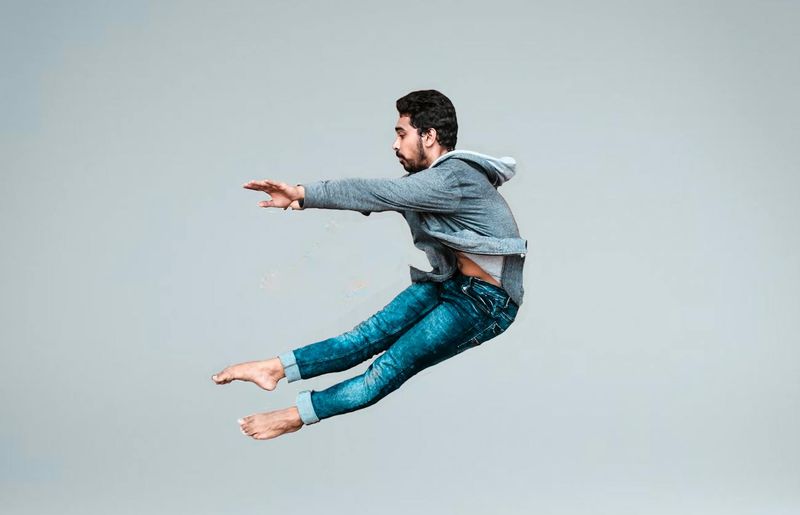 Dynamic shot of a woman in mid-movement, full of energy.